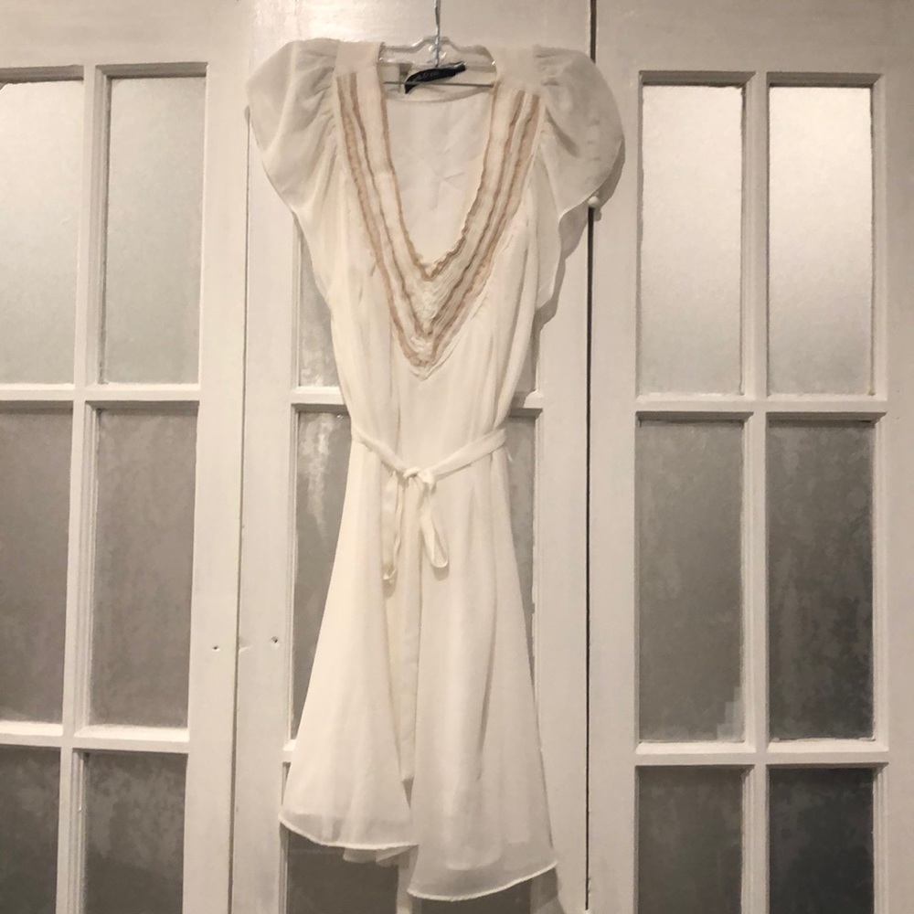 White dress with beige detail